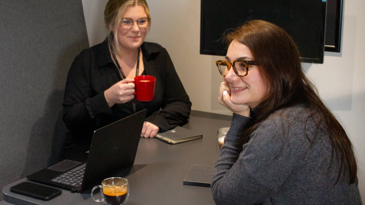 two FreshGround employees encouraging a coffee and chat (coffee helps recruitment and retention)