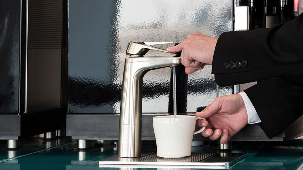 office staff using water dispenser